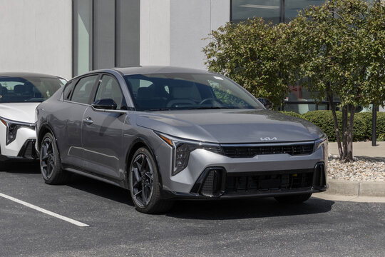 Kia K4 GT-Line Compact Sedan at a dealership. Kia offers the K4 with a 2.0L GDI 4-Cylinder engine. MY:2026