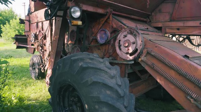 old red combine harvester repair threshing machine replacement of whips on the drum welding work to improve the efficiency of the unit
