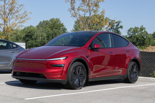 Tesla Model Y Electric Midsize SUV at a dealership. Tesla offers the Model Y with up to 327 miles driving range. MY:2026