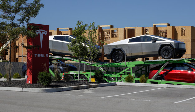 Tesla Cybertruck Electric Utility Truck display. Tesla offers the Cybertruck with up to 325 miles driving range. MY:2026