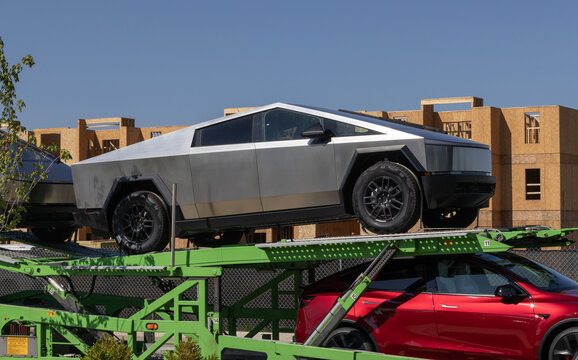 Tesla Cybertruck Electric Utility Truck display. Tesla offers the Cybertruck with up to 325 miles driving range. MY:2026