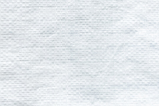 White Woven Plastic Sack Texture Background,Macro,Close-up texture background of a white woven plastic sack, polypropylene fabric, or synthetic packaging material, showing a detailed grid pattern.