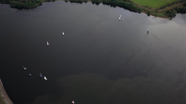 Aerial Video of Sailing Dinghies Dispersed Across Elton Reservoir in Bury, Greater Manchester. 