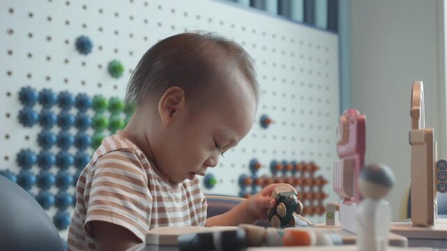 A child engages in imaginative play with colorful educational toys, enhancing creativity and cognitive skills. This playful scene highlights the importance of interactive learning in early childhood d