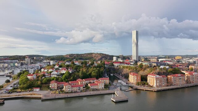 Aerial view of Karlatornet skyscraper towering over the waterfront residential area and harbor in Gothenburg, Vastra Gotaland County, Sweden.