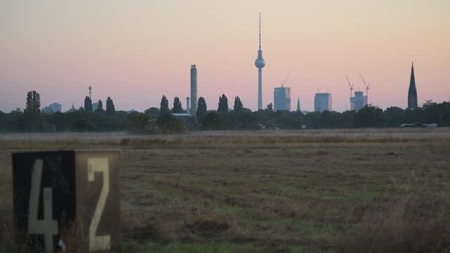 skyline of Berlin downtown from Tempelhofer Feld at sunrise 4K