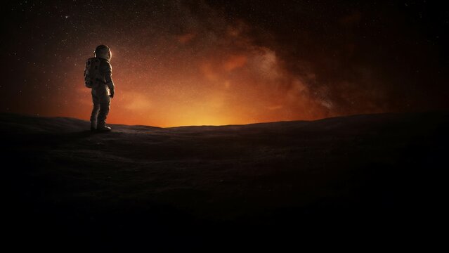 Astronaut standing on a dark alien planet looking at a bright glowing cosmic horizon