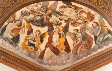 Fototapeta premium Busto Arsizio - The fresco of angels with the music instruments in the church Santuario di Santa Maria di Piazza by Giovan Battista della Cerva (1542).