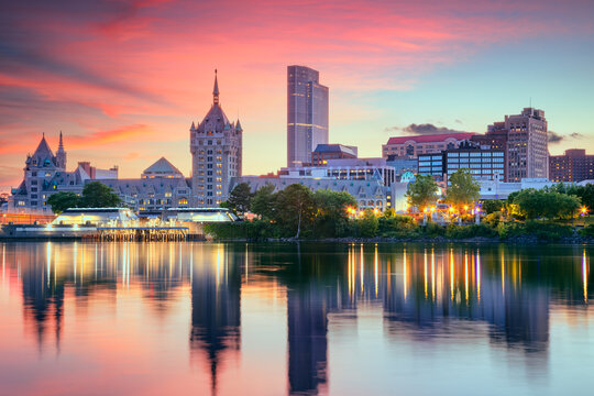 Albany, New York, USA. Cityscape image of Albany, New York with reflection of the city skyline in the water at beautiful sunrise.