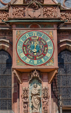 Sundials and Virgin Mary sculpture on south transept of Strasbourg Cathedral