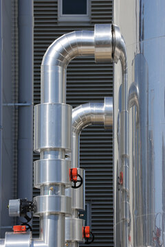 View of vertical data centre cooling pipework and valve assemblies