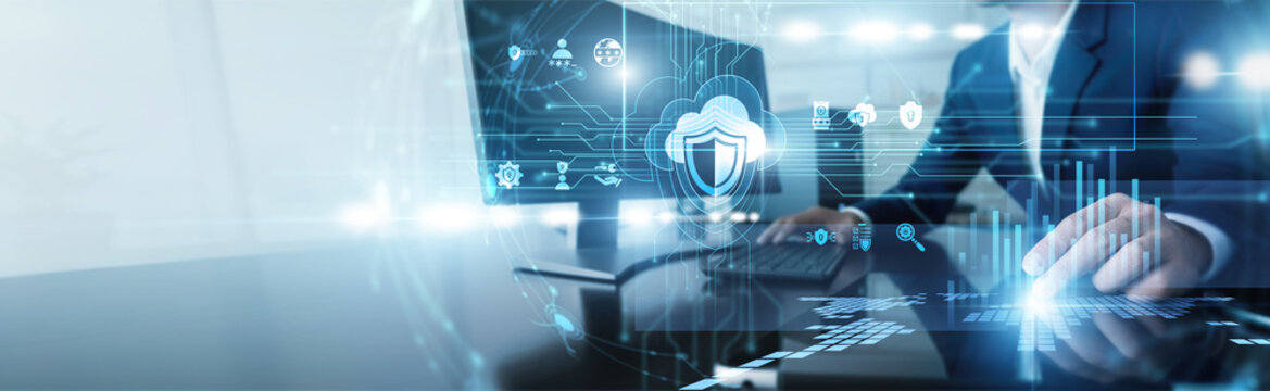 Cybersecurity expert working on computer in cloud security. Specialist protecting virtual servers and data storage from external threats using advanced encryption and firewall technologies.