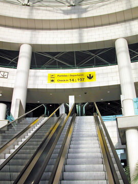 Partidas Departures. Escalator access inside the terminal of the Humberto Delgado International Airport in Lisbon, capital of Portugal, in southern Europe