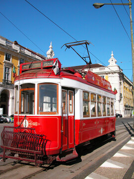 Historic red tram for sightseeing tours of the Lisbon company Companhia Carris de Ferro at the Pra&ccedil;a do Com&eacute;rcio (Commerce Square) stop. Romantic visit to Lisbon, Portugal, southern Europe. 