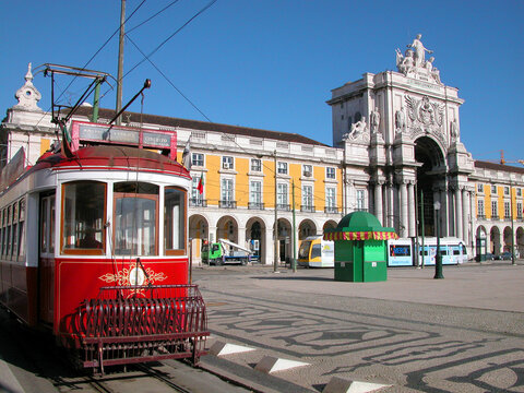 Historic red tram for sightseeing tours of the Lisbon company Companhia Carris de Ferro at the Pra&ccedil;a do Com&eacute;rcio (Commerce Square) stop. Romantic visit to Lisbon, Portugal, southern Europe. 