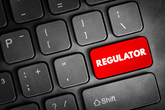 REGULATOR key on computer keyboard symbolizing oversight, compliance control, authority governance, policy enforcement, industry supervision and legal framework in digital and financial systems