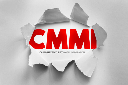 CMMI Capability Maturity Model Integration text shown through torn paper design, business process concept representing quality improvement, performance measurement and organizational development