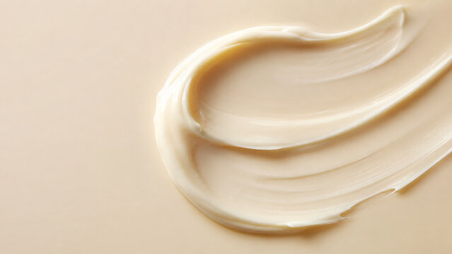 Minimal ceramide cream smear on warm ivory background, glossy moisturizer texture with copy space for premium skincare, beauty and dermatology advertising