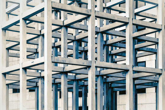 View of a modern architectural grid structure with intersecting concrete beams and geometric patterns on a building facade in Islamabad, Islamabad Capital Ter, Pakistan.