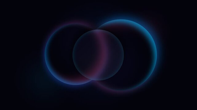 Abstract composition of two intersecting glowing spheres in deep darkness