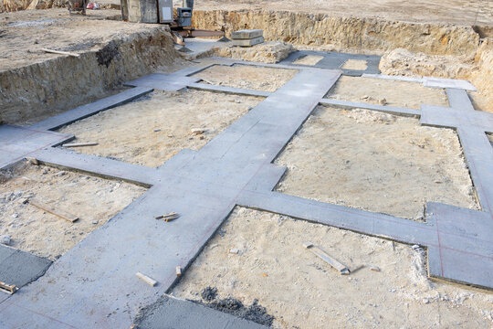 concrete strip footing foundation at house construction site