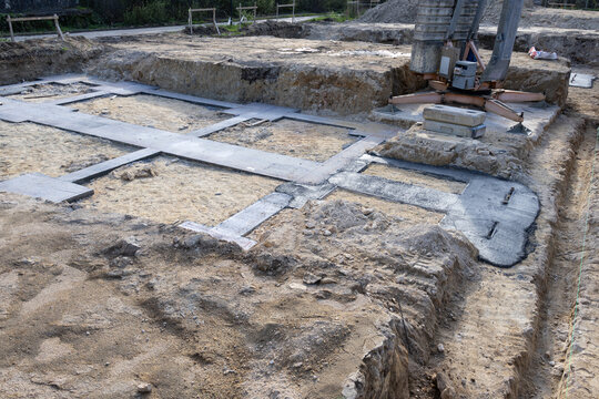concrete foundation footprint at residential building construction site