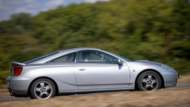 Milton Keynes; UK - Aug 23rd 2026:;  2002 Toyota Celica car driving on a British road