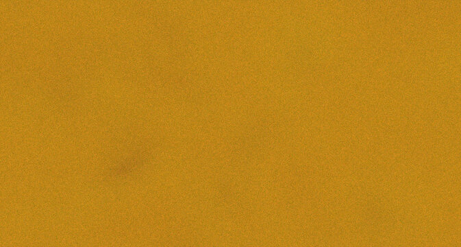 Solid mustard yellow grainy noise background with fine film grain texture for vintage poster design backdrop