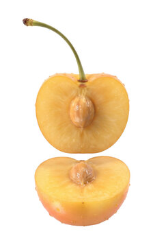 Fresh Yellow Cherry Fruit Cut in Half with Seed and Stem