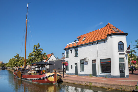 Traditional sailing boat in the historic canal in Meppel, Netherlands