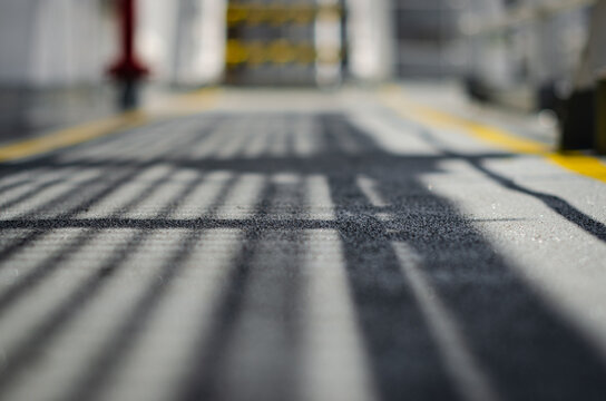 Close-up view of the exterior deck surface on board an offshore support vessel, fitted with an anti-slip adhesive coating to improve crew footing