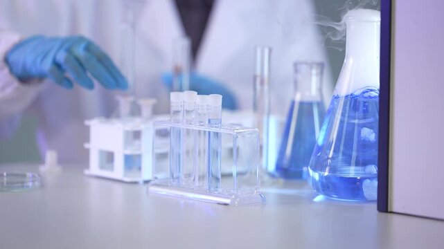 Laboratory equipment arranged on a clean research bench inside a busy medical diagnostics laboratory, shot in 4K for medical, science and biotechnology projects.