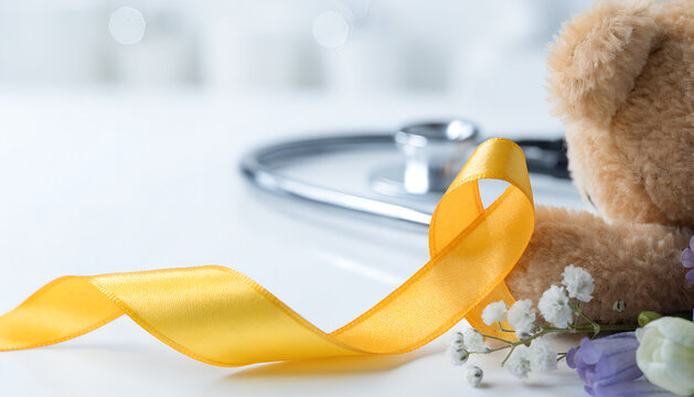 Pediatric leukemia and blood cancer awareness background, teddy bear with yellow ribbon on white. Hope for cure in children oncology, Blood disorder and leukemia in children, Childhood cancer awarenes