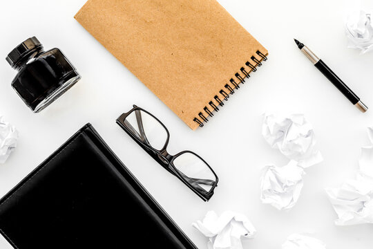 writer workplace with tools for work on white table background top view mockup