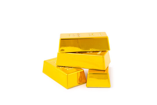 Gold bars isolated on white background. Stack of many shiny gold bars. Fine gold concept. Gold panel background.  Metallic texture. Wealth, luxury, treasure.