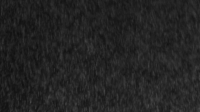 Night Shower With Wind. Heavy night rain with wind in the headlights on a black background