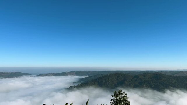 Breathtaking rolling green mountain hills aerial view. Dense morning clouds sea. Scenic nature landscape Meghalaya, Nepal mount everest. Travel tourism environment outdoor adventure 