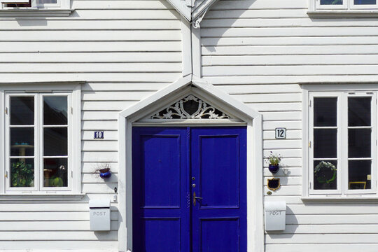 Stavanger white wooden house blue door entrance