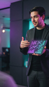 Man presenting analytics on a tablet