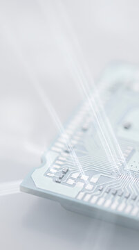 Vertical macro view of white electronic circuit board with light rays