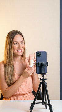 Woman reviews beauty product on phone