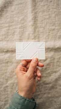 Designer holds textured business card