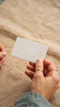 Designer holding blank business card
