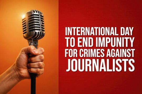 Hand holding a vintage microphone for international day to end impunity for crimes against journalists