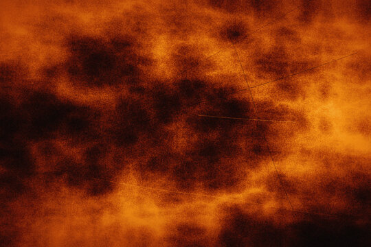 Vibrant orange fire smoke background with intense glowing colors and dark shadows serves as an energetic texture for posters or digital artwork design.