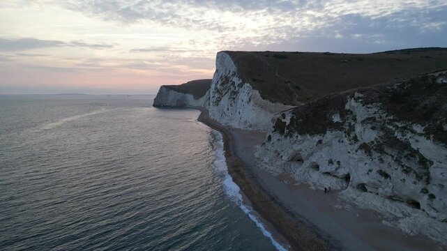 Drone fly forward shot passing over foreground cliff towards Bats Head Dorset