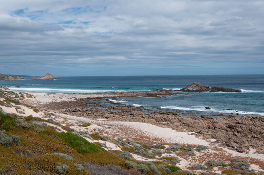 Sandy dunes overlooking the blue Indian Ocean