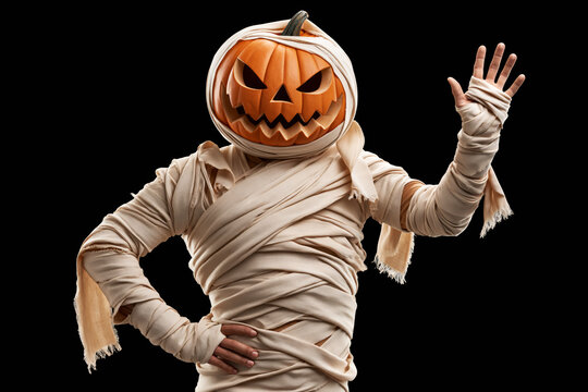 Jack-o-lantern headed mummy figure wrapped in bandages, peace sign gesture