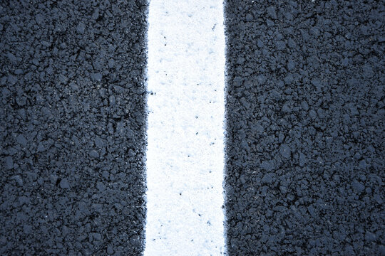  New black asphalt texture with white road marking line close up