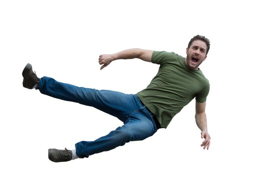 Shocked man wearing green t-shirt falling backward with flying kick gesture